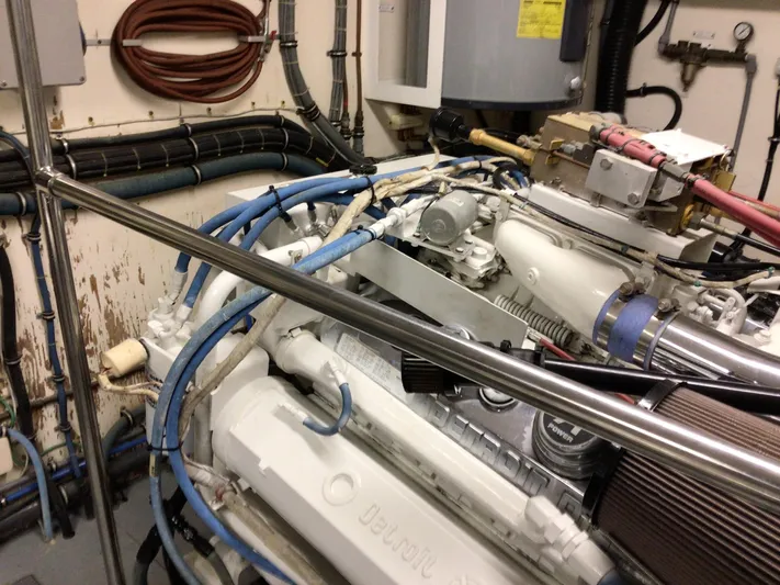 Reflections Yacht Photos Pics Engine room of 1993 Hatteras 60 ED yacht, featuring Detroit Diesel engine components.