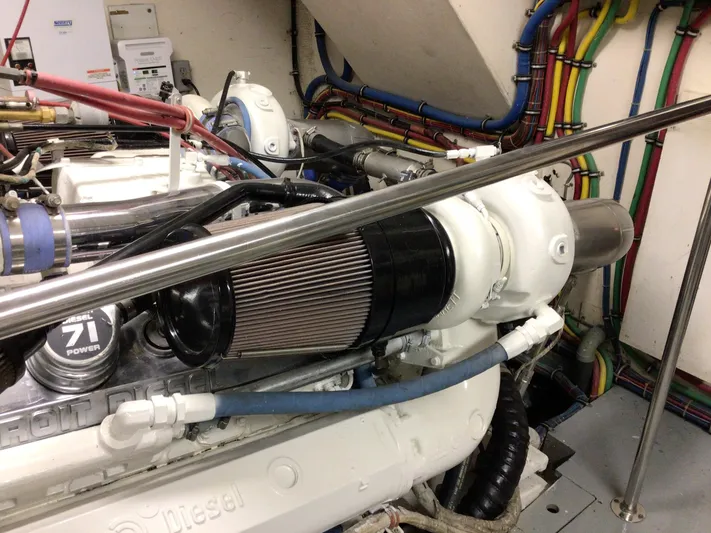 Reflections Yacht Photos Pics Engine room of 1993 Hatteras 60 ED yacht with Detroit Diesel components and colorful wiring.