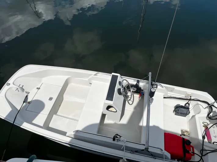 Reflections Yacht Photos Pics Aerial view of a 1993 Hatteras 60 ED boat docked on calm water.