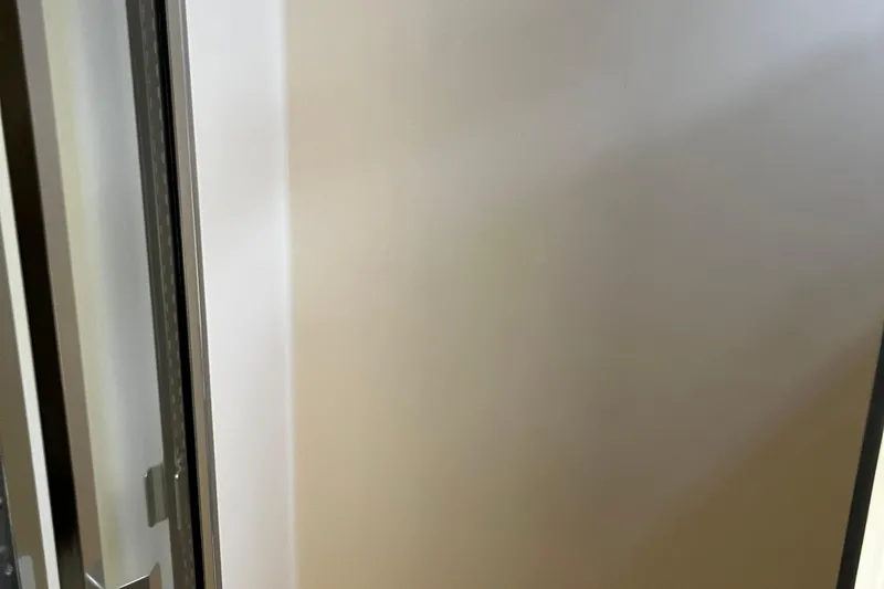 Reflections Yacht Photos Pics Interior view of a 1993 Hatteras 60 ED yacht, featuring a sleek door design.