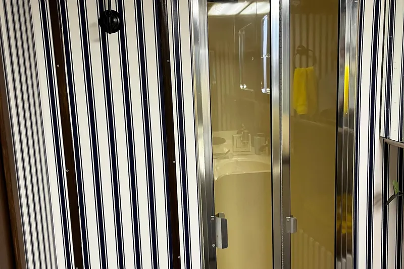 Reflections Yacht Photos Pics Striped wall and glass door in 1993 Hatteras 60 ED yacht interior.