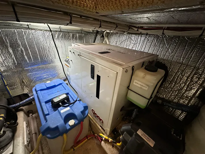  Yacht Photos Pics Engine room of 2007 Nordic Tug 32 with generator and battery.