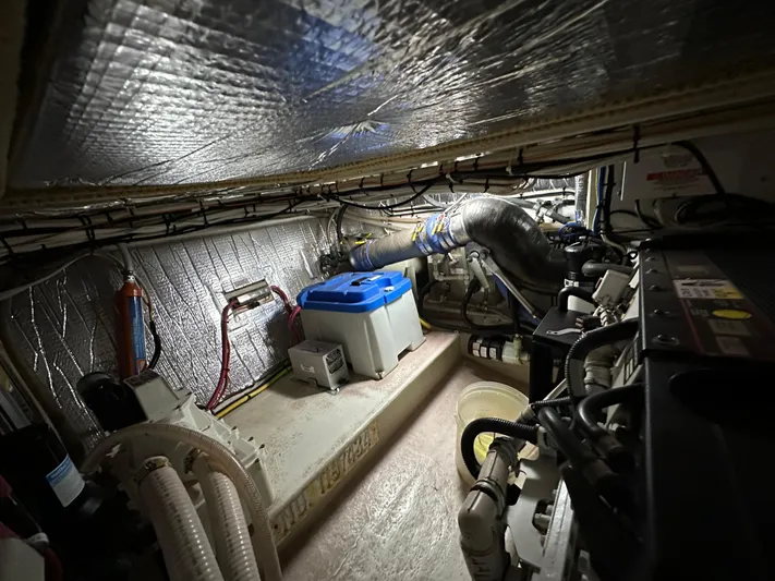  Yacht Photos Pics Engine room of a 2007 Nordic Tug 32, featuring insulated walls and mechanical components.