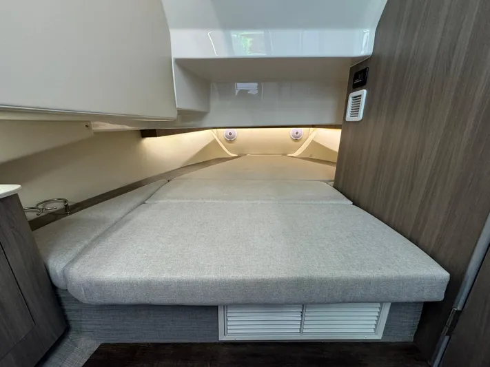 Mullin' It Over Again Yacht Photos Pics 2019 Regal 33 SAV cabin interior with cozy bed and modern design.