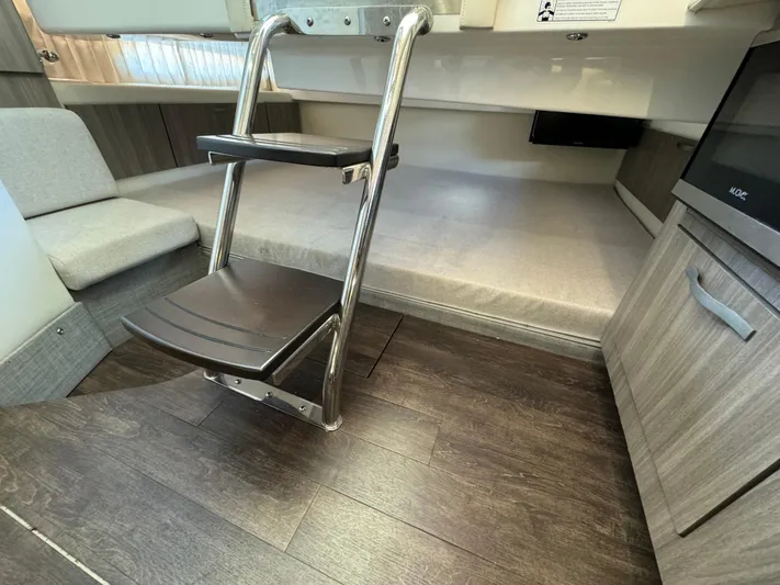 Mullin' It Over Again Yacht Photos Pics Interior of 2019 Regal 33 SAV boat with ladder and seating area.
