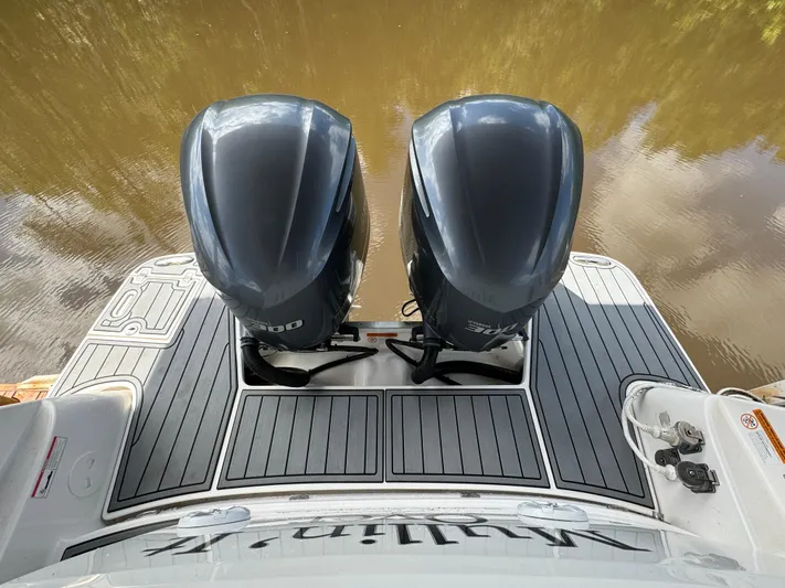 Mullin' It Over Again Yacht Photos Pics 2019 Regal 33 SAV boat with dual outboard engines on a calm water surface.