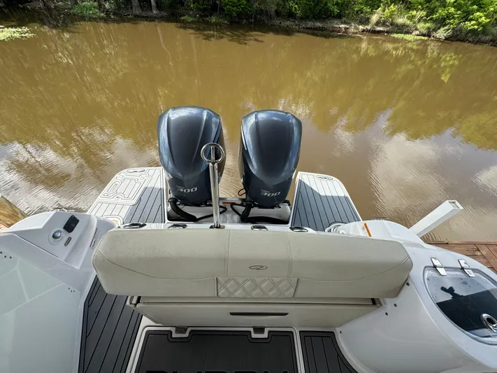 Mullin' It Over Again Yacht Photos Pics 2019 Regal 33 SAV boat with twin outboard engines on a calm river.