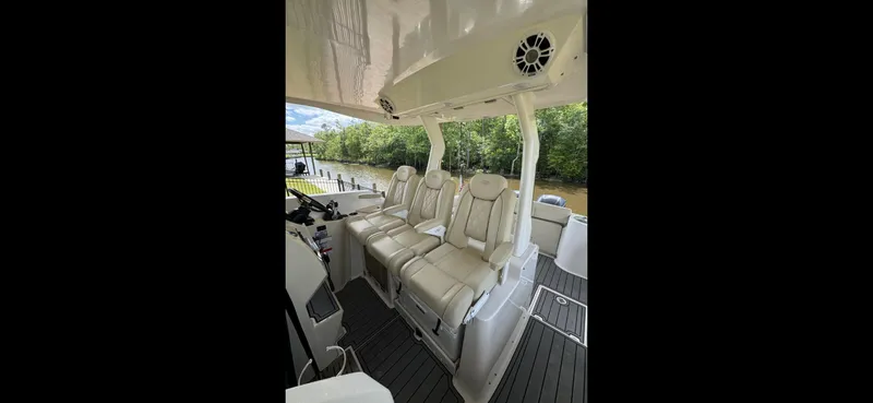 Mullin' It Over Again Yacht Photos Pics 2019 Regal 33 SAV boat interior with plush seating and modern design.