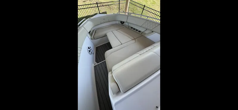 Mullin' It Over Again Yacht Photos Pics 2019 Regal 33 SAV boat interior with beige seating and sleek design.