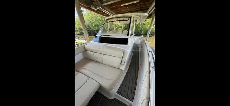 Mullin' It Over Again Yacht Photos Pics 2019 Regal 33 SAV boat interior with white seating and sleek design.
