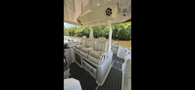 Mullin' It Over Again Yacht Photos Pics 2019 Regal 33 SAV boat interior with plush seating and sleek design.