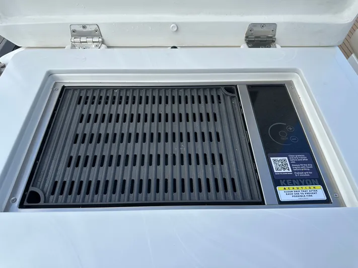  Yacht Photos Pics Built-in grill on 2025 Aquila 36 Sport boat, featuring Kenyon electric cooktop.