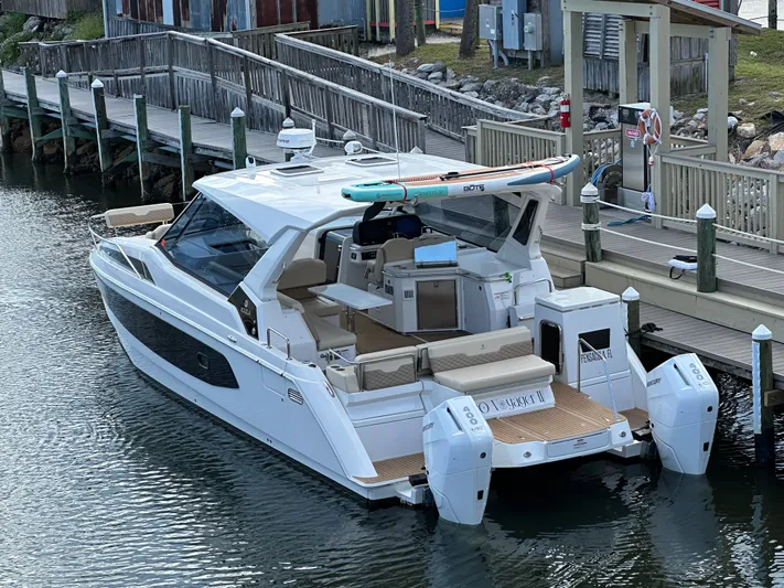  Yacht Photos Pics 2025 Aquila 36 Sport boat docked, featuring sleek design and modern amenities.