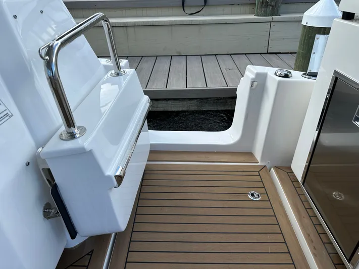  Yacht Photos Pics Aquila 36 Sport 2025 boat deck with sleek design and stainless steel railing.
