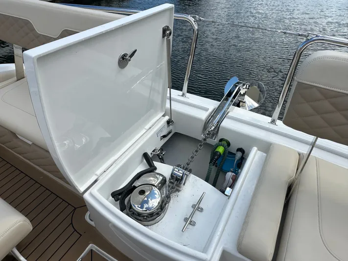  Yacht Photos Pics Aquila 36 Sport 2025 boat anchor compartment with open lid, showing chain and winch.