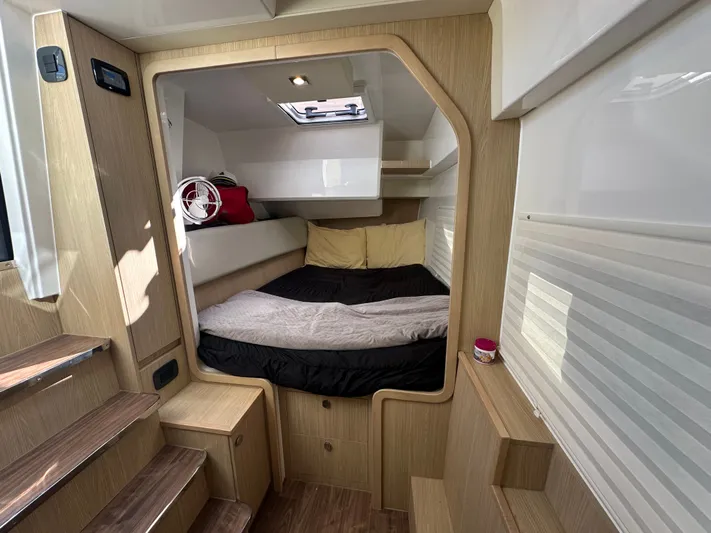  Yacht Photos Pics Interior cabin of 2025 Aquila 36 Sport yacht with cozy bed and modern design.