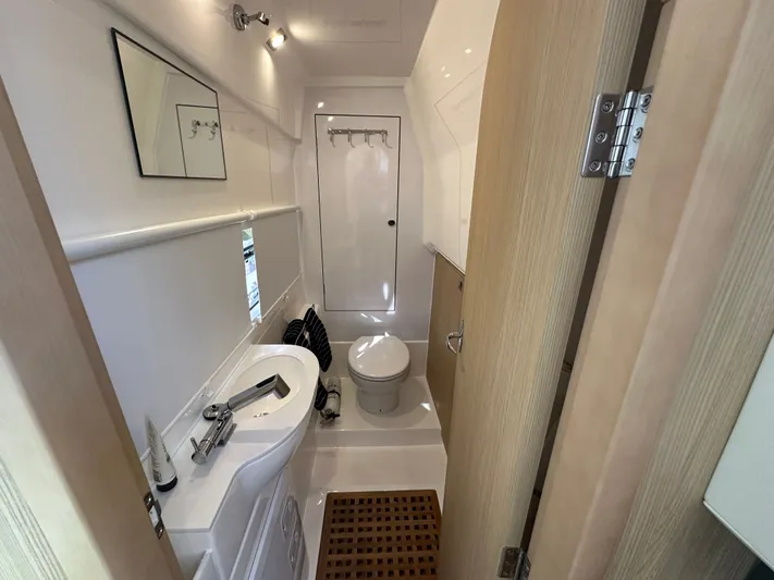  Yacht Photos Pics Modern bathroom interior of 2025 Aquila 36 Sport yacht, featuring sleek design and compact amenities.