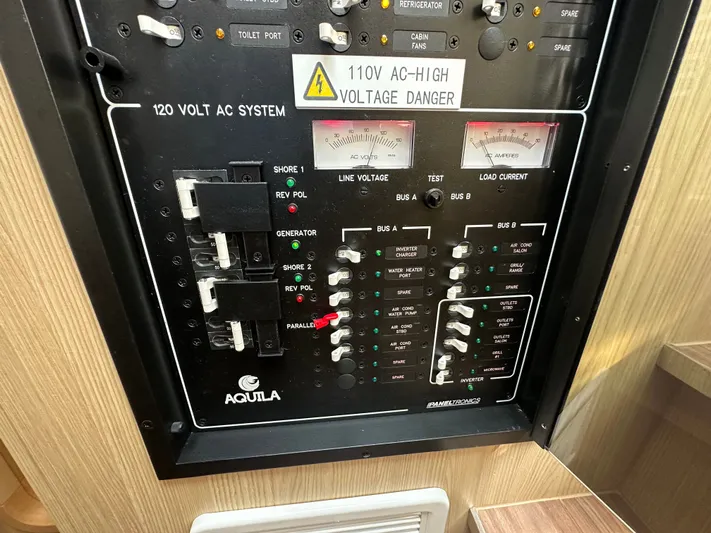  Yacht Photos Pics Electrical control panel of 2025 Aquila 36 Sport boat, featuring 120V AC system.
