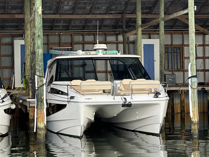  Yacht Photos Pics 2025 Aquila 36 Sport boat docked in a marina, front view.