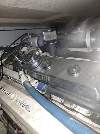  Yacht Photos Pics Engine compartment of a 1999 Hatteras 50 Convertible yacht, featuring Detroit Diesel components.