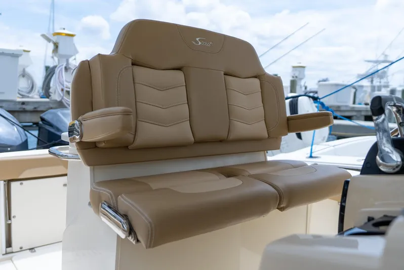 Innisfree Yacht Photos Pics Luxurious seating on a 2015 Scout 300 LXF boat, featuring tan leather upholstery.