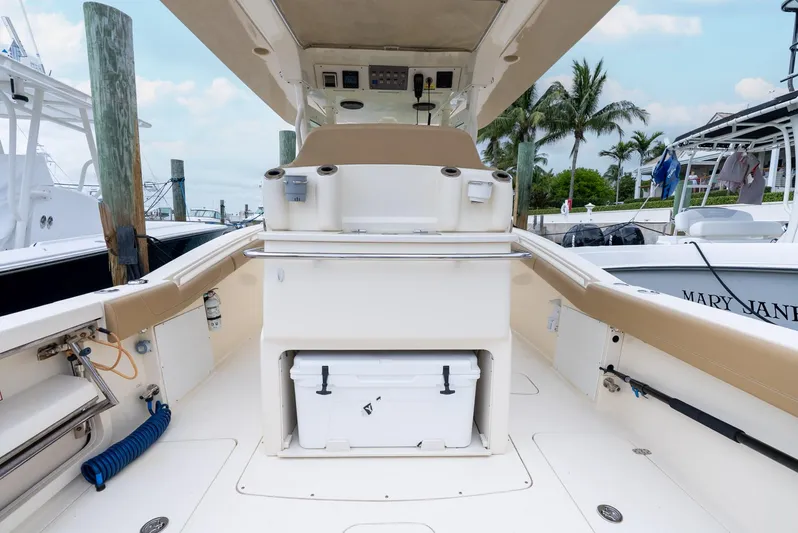 Innisfree Yacht Photos Pics 2015 Scout 300 LXF boat interior with seating and storage, docked at marina.