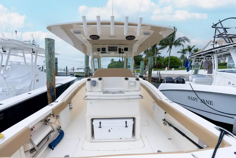 Innisfree Yacht Photos Pics 2015 Scout 300 LXF boat docked, featuring spacious deck and modern amenities.