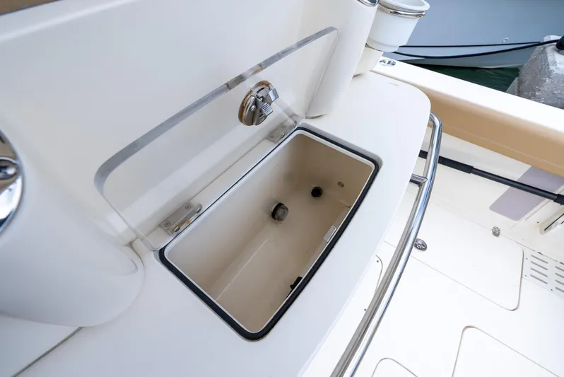 Innisfree Yacht Photos Pics Open storage compartment on 2015 Scout 300 LXF boat deck.
