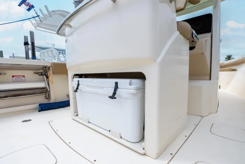 Innisfree Yacht Photos Pics 2015 Scout 300 LXF boat interior with built-in cooler storage.