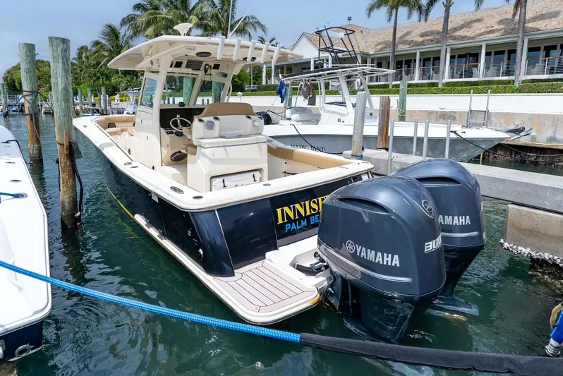 Innisfree Yacht Photos Pics 2015 Scout 300 LXF boat docked, featuring dual Yamaha engines, in a marina setting.