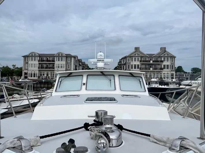 Veritas Yacht Photos Pics Wesmac 42 boat docked at marina with waterfront buildings, 2016 model.