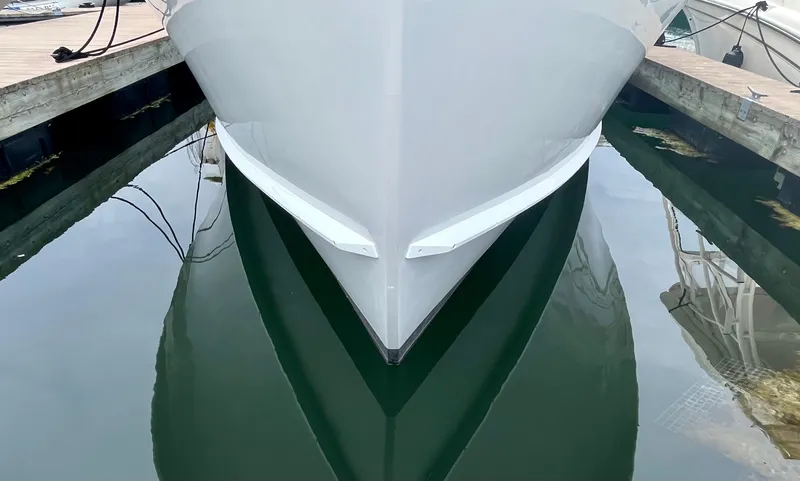 Veritas Yacht Photos Pics Wesmac 42 boat from 2016 docked, reflecting on calm water.