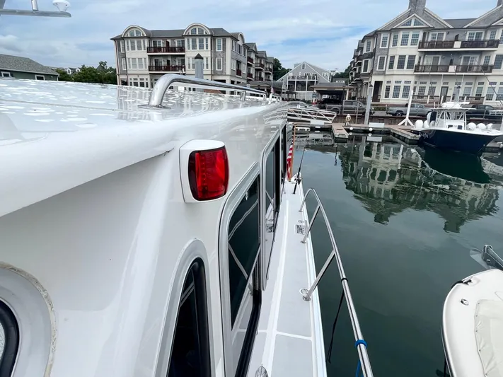 Veritas Yacht Photos Pics Wesmac 42 yacht docked in marina with waterfront buildings, 2016 model.