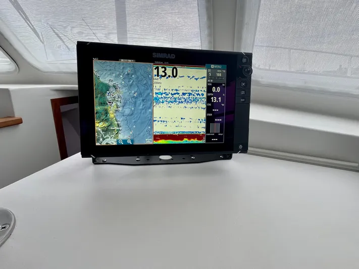Veritas Yacht Photos Pics Simrad marine display on 2016 Wesmac 42 boat, showing navigation and sonar data.