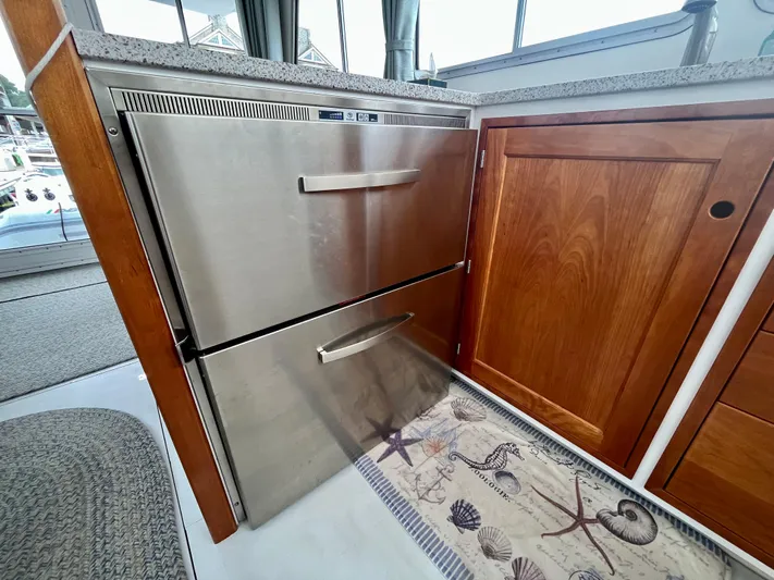 Veritas Yacht Photos Pics Stainless steel drawers in 2016 Wesmac 42 boat interior, next to wooden cabinetry.