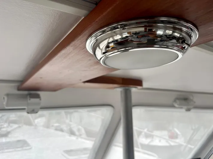 Veritas Yacht Photos Pics Interior of 2016 Wesmac 42 boat with modern ceiling light fixture.