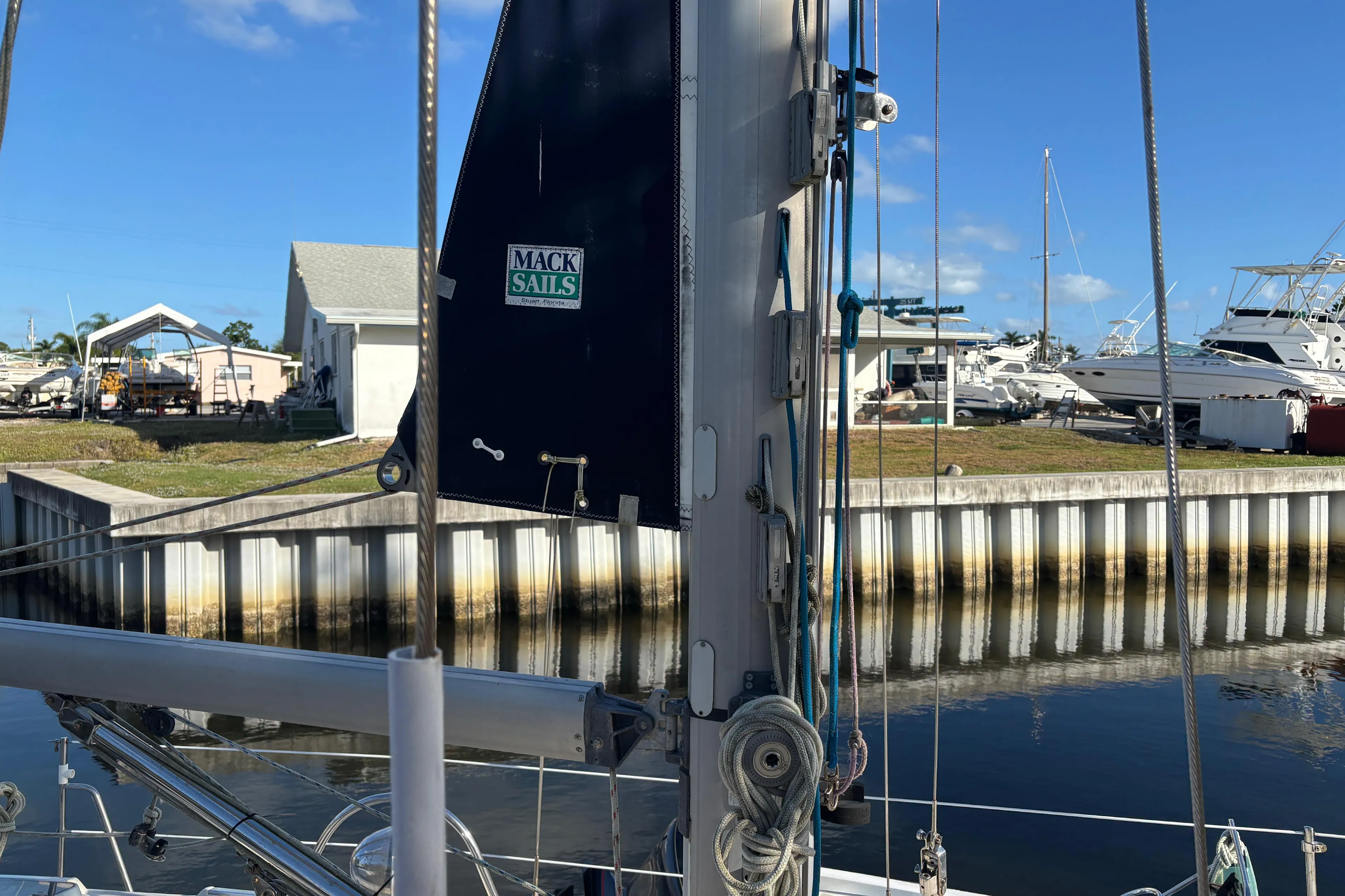 Sailboat docked with Mack Sails, Caliber 40LRC, 1997 model, in a marina setting.