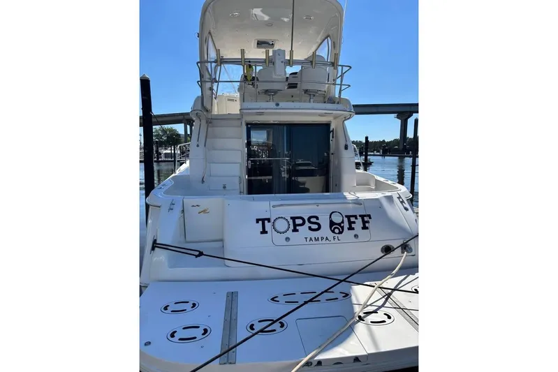  Yacht Photos Pics 2001 Sea Ray 480 Sedan Bridge yacht docked, rear view, named "Tops Off," Tampa, FL.