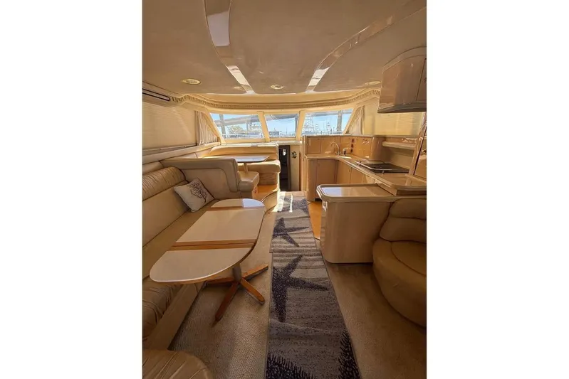  Yacht Photos Pics Luxurious interior of a 2001 Sea Ray 480 Sedan Bridge yacht with elegant furnishings.
