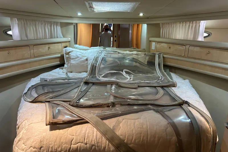  Yacht Photos Pics Interior of 2001 Sea Ray 480 Sedan Bridge with bed and storage cabinets.