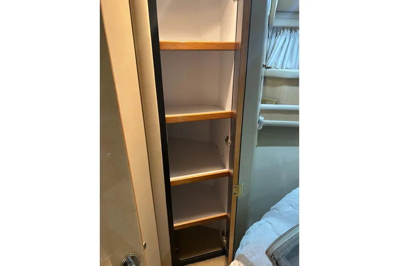  Yacht Photos Pics 2001 Sea Ray 480 Sedan Bridge interior shelving with wooden accents.