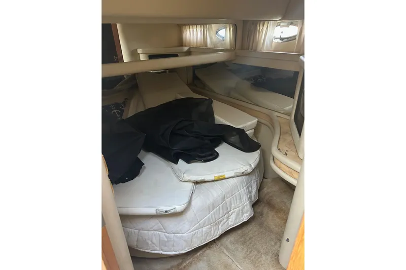  Yacht Photos Pics 2001 Sea Ray 480 Sedan Bridge cabin interior with bed and storage.