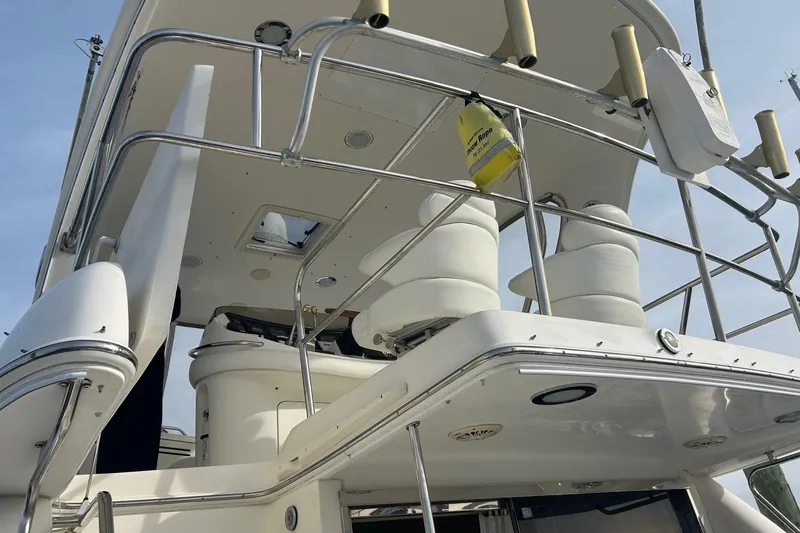  Yacht Photos Pics 2001 Sea Ray 480 Sedan Bridge yacht, upper deck view with seating and railings.