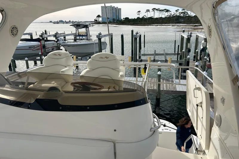  Yacht Photos Pics 2001 Sea Ray 480 Sedan Bridge yacht docked at marina with scenic waterfront view.