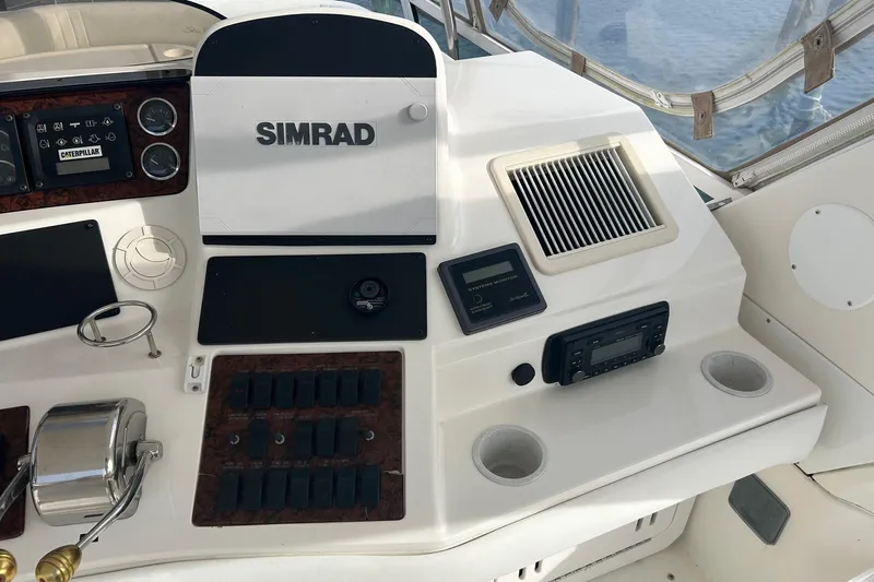  Yacht Photos Pics Control panel of a 2001 Sea Ray 480 Sedan Bridge with Simrad electronics.