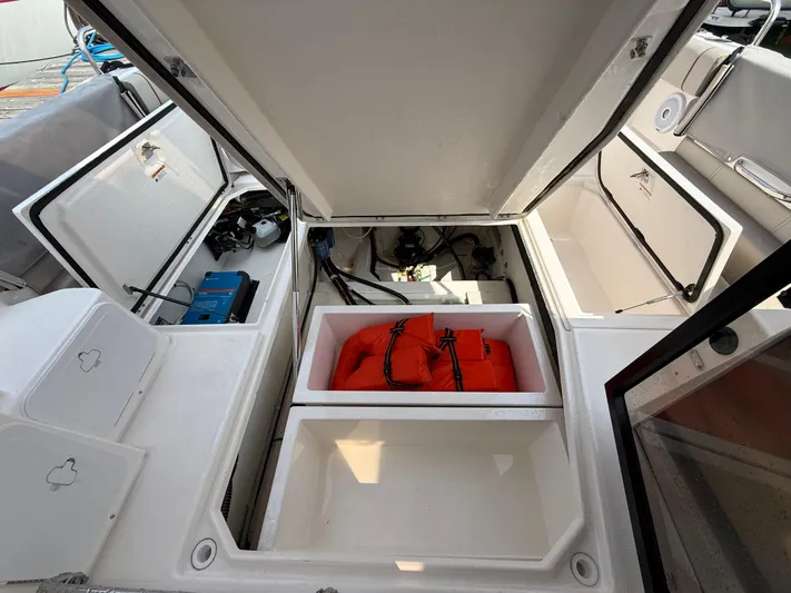  Yacht Photos Pics 2021 Cutwater C-32 C boat storage compartments with life jackets and equipment.