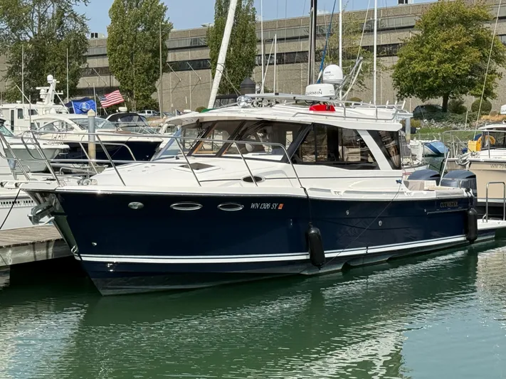  Yacht Photos Pics 2021 Cutwater C-32 C boat docked in marina, featuring sleek design and modern amenities.