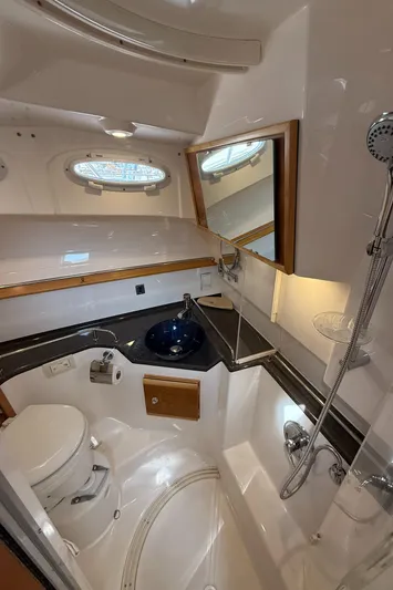  Yacht Photos Pics 2021 Cutwater C-32 C boat bathroom with shower, sink, and toilet.