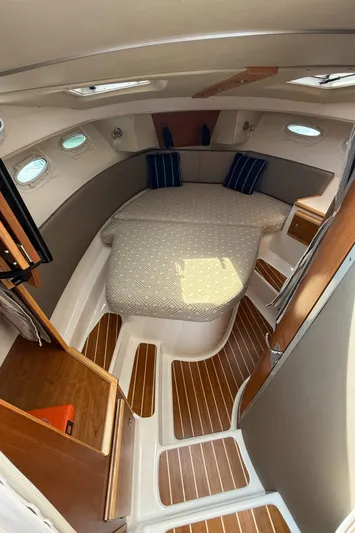  Yacht Photos Pics Interior of 2021 Cutwater C-32 C boat with cozy cabin and wooden flooring.