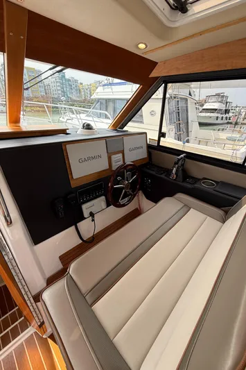  Yacht Photos Pics 2021 Cutwater C-32 C helm with Garmin displays and leather seating.